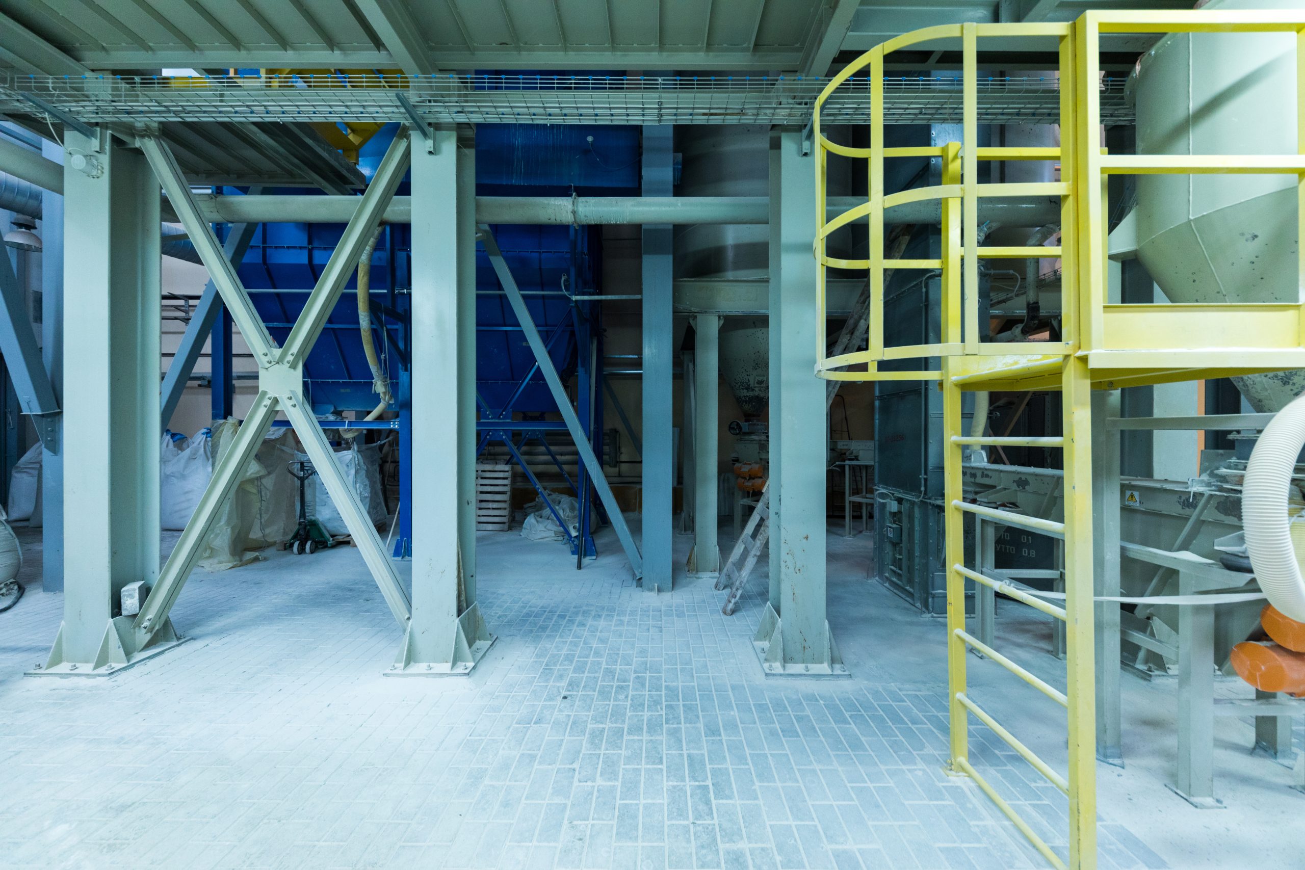 Modern operational plant equipment with some bags of chemicals heavy industry machinery metalworking workshop concept.